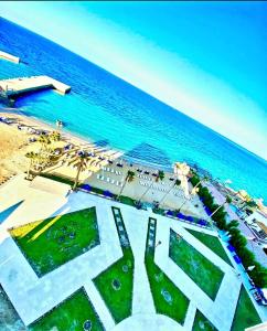 an aerial view of the beach and the ocean at Seaview 2 Bedroom Private Deluxe Condo at Juliana Beach Resort B2-09 in Hurghada +19 photos