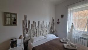 A bed or beds in a room at Il Mare Di Roma