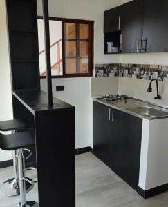 Kuchyň nebo kuchyňský kout v ubytování Habitación matrimonial con vista al mar-wanderlust