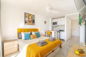 a bedroom with a large bed and a kitchen at GOLDEN VIEW Ponderosa in Costa de Adeje +47 photos