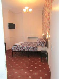 a bedroom with a bed in a room at Belroy Hotel in Blackpool