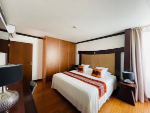 Voodi või voodid majutusasutuse Coral suite vue sur mer toas