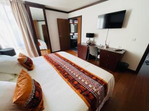 Postel nebo postele na pokoji v ubytování Coral suite vue sur mer