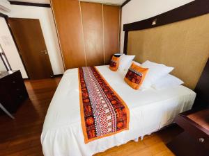 Postel nebo postele na pokoji v ubytování Coral suite vue sur mer
