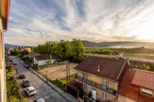 an aerial view of a city with buildings and cars at Veigas de Iria - Apartamento Turístico VUT in Padrón