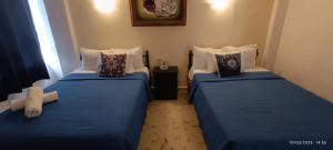 Cama ou camas em um quarto em Hotel Coral