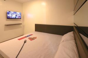 Postel nebo postele na pokoji v ubytování Hotel Sogo San Jose Del Monte, Bulacan