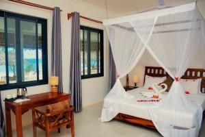 Postel nebo postele na pokoji v ubytování MANOLO Beach Resort + 16 fotografií