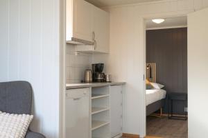 Voodi või voodid majutusasutuse Lofoten Værøy Bryggehotell AS toas