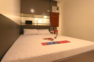 Postel nebo postele na pokoji v ubytování Hotel Sogo San Jose Del Monte, Bulacan