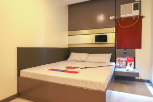Postel nebo postele na pokoji v ubytování Hotel Sogo San Jose Del Monte, Bulacan + 17 fotografií