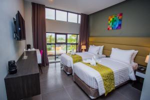 Postel nebo postele na pokoji v ubytování Hotel Costa Brava
