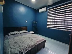 Postel nebo postele na pokoji v ubytování Sejati Homestay Paka Dungun + 2 fotografie