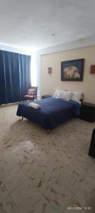 Cama ou camas em um quarto em Hotel Coral