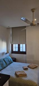 Katil atau katil-katil dalam bilik di Apartamento Palacio Salvo