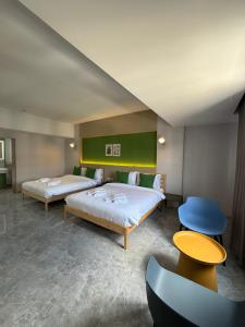 Postel nebo postele na pokoji v ubytování Chill Chill Hotel