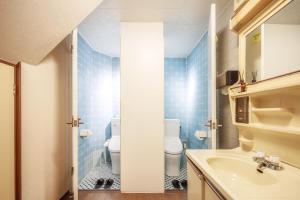 a bathroom with a toilet and a sink at Yadoya Hiraiwa private ryokan in Kyoto +37 photos