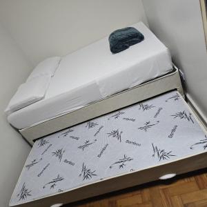 two mattresses stacked on top of each other at Le house hostel in São Paulo