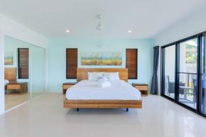 Whitsunday Escape - Beachfront with Private Pool客房内的一张或多张床位