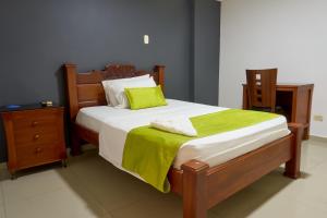 Rúm í herbergi á Hotel el imperio