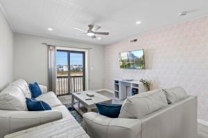 a living room with two couches and a table at Jersey Shore Getaway in Seaside Heights