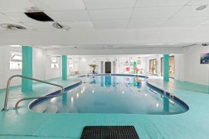a large swimming pool in a large building at Jersey Shore Getaway in Seaside Heights