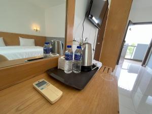 Postel nebo postele na pokoji v ubytování Morib Prosper Resort by uBook