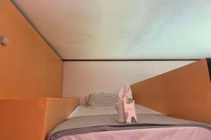 Green Dale's Travellers Inn Puerto Princesa客房内的一张或多张床位