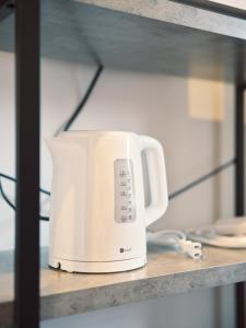 a white toaster sitting on a shelf at vetta Minami-Kumamoto Station 803 in Kumamoto