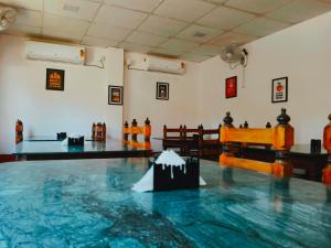 a view of a gymnasium with a bowling alley at Sands - Tajpur in Tajpur
