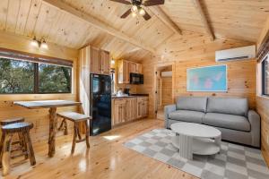 a living room with a couch and a table at Happy Travelers RV Resort in Thonotosassa