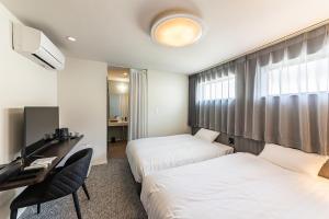 Wonders Hotel 객실 침대
