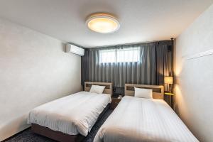 Wonders Hotel 객실 침대