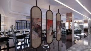 a restaurant with four surfboards hanging on a wall at Khách Sạn Hạo Nhiên in Buon Ma Thuot