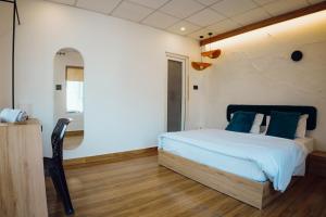 Art Bliss Hostel客房内的一张或多张床位