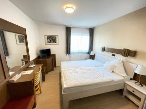 Postel nebo postele na pokoji v ubytování Hotel Princess