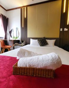 Postel nebo postele na pokoji v ubytování HA Hotel & Apartment