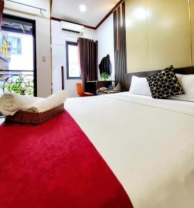 Postel nebo postele na pokoji v ubytování HA Hotel & Apartment