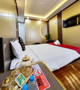 Postel nebo postele na pokoji v ubytování HA Hotel & Apartment