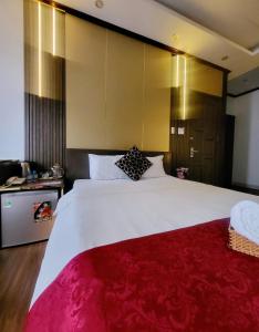 Postel nebo postele na pokoji v ubytování HA Hotel & Apartment