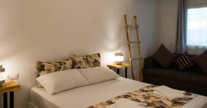 Postel nebo postele na pokoji v ubytování Pataros Hotel