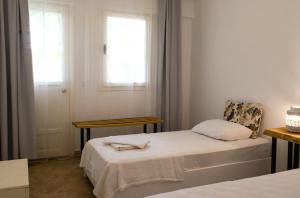 Postel nebo postele na pokoji v ubytování Pataros Hotel