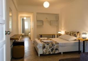 מיטה או מיטות בחדר ב-Pataros Hotel