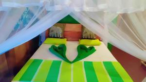 Voodi või voodid majutusasutuse Sigiri Aliya Tree house toas