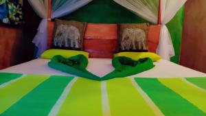 Voodi või voodid majutusasutuse Sigiri Aliya Tree house toas