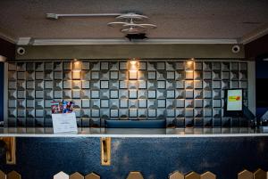 a counter in a restaurant with a tile wall at Super 8 by Wyndham Biloxi in Biloxi