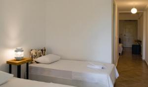 Postel nebo postele na pokoji v ubytování Pataros Hotel