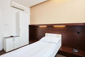 Postel nebo postele na pokoji v ubytování Hotel Rottal