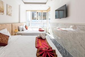 Postel nebo postele na pokoji v ubytování Nghia Lan Hotel
