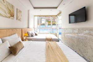 Postel nebo postele na pokoji v ubytování Nghia Lan Hotel